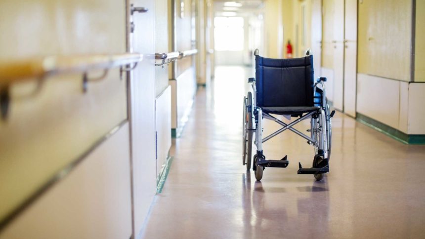 riderless wheelchair in a healthcare setting hallway