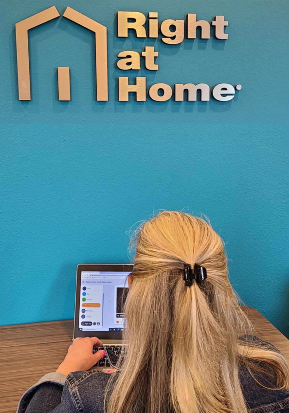 A care manager from Right at Home Northwest Houston uses the SparxConnect platform on her computer