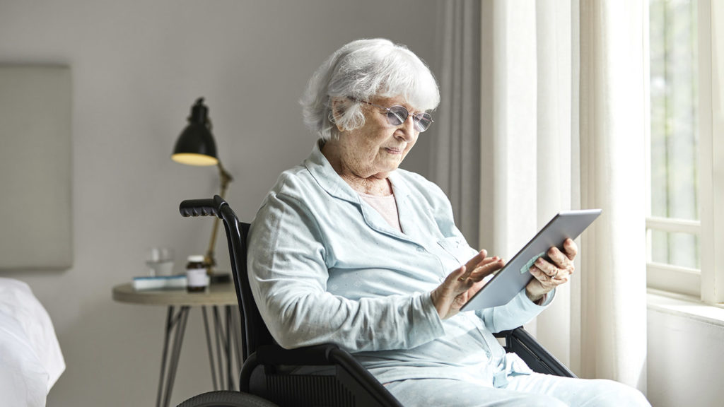 woman looking at tablet computer