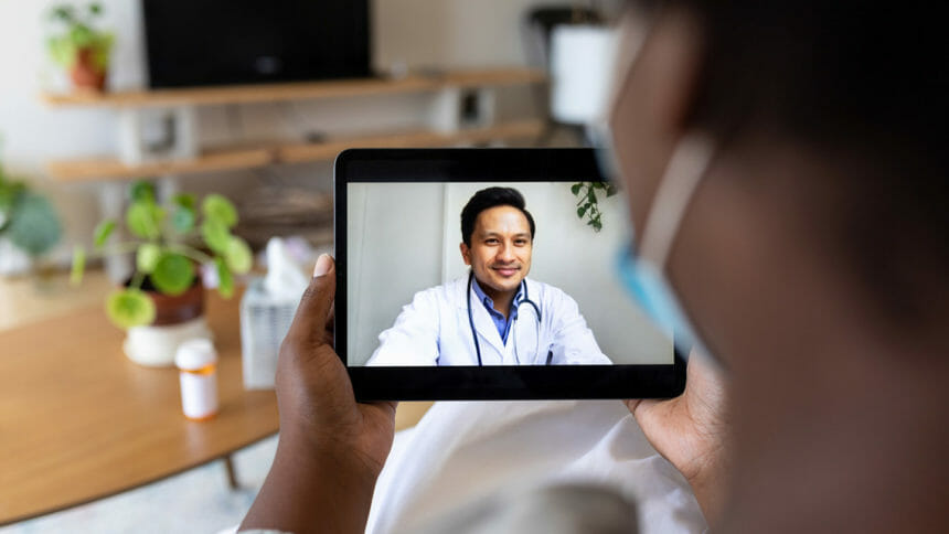 Woman consulting doctor on tablet