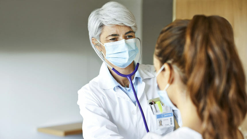 Medical worker examining patient