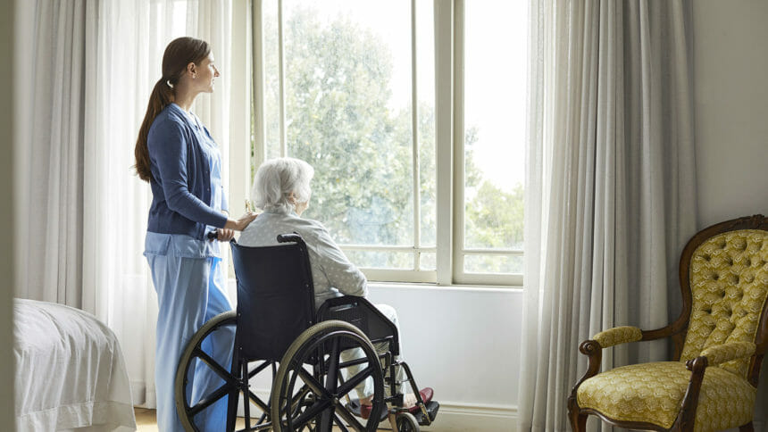 Nurse with elderly woman in her home