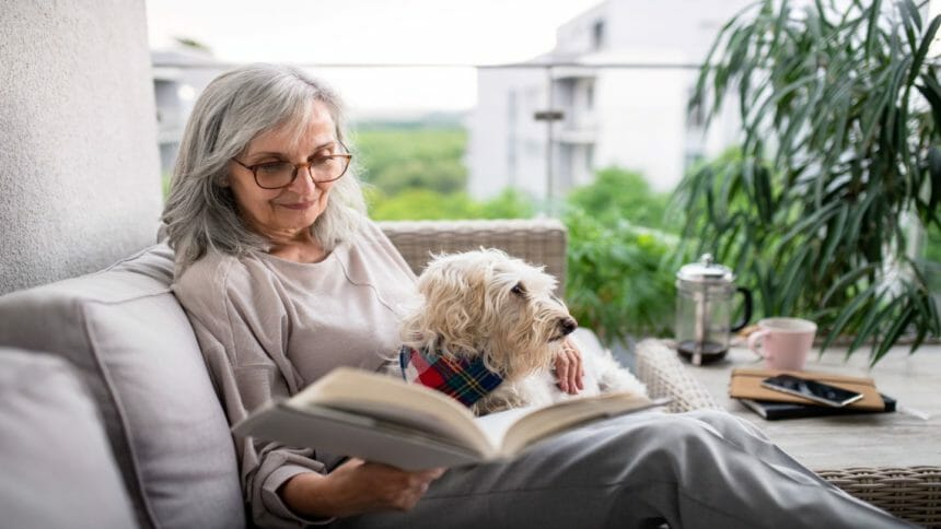Older adult woman reading book