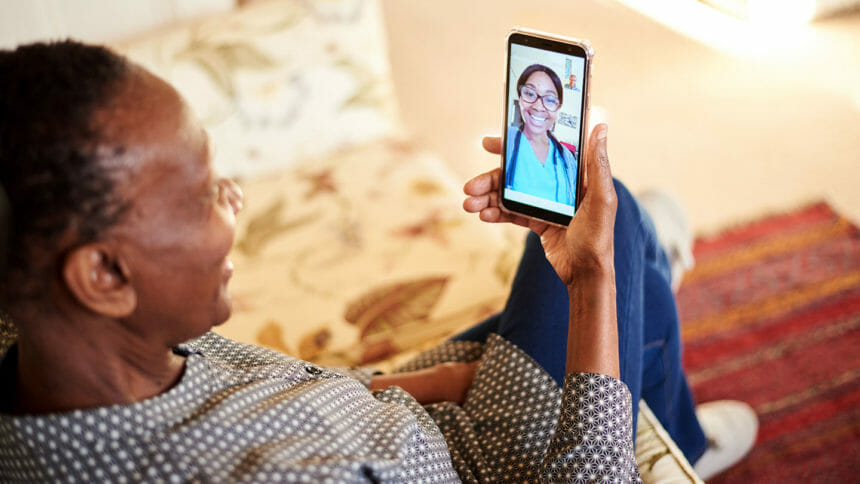 Man on smartphone with nurse