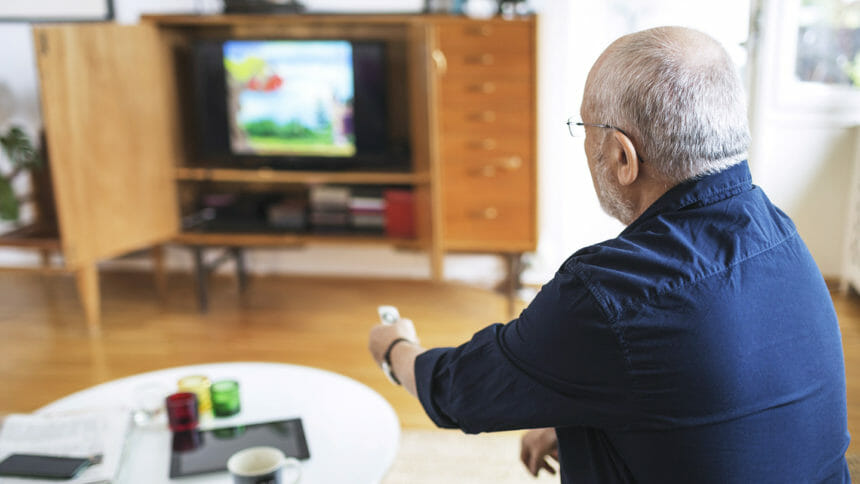 senior man in front of smart TV
