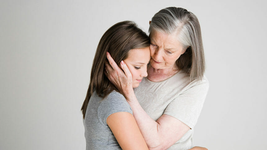 Woman consoling granddaughter