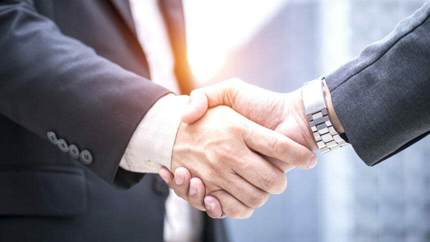 Businessman shaking hand with business partner investment for success plan