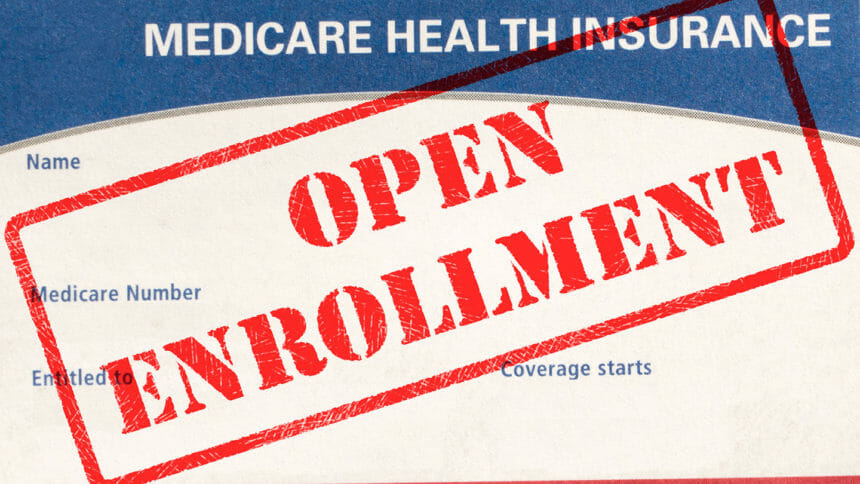 Open Enrollment Rubber Stamp On A Medicare Card