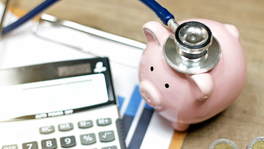 stethoscope and piggy bank