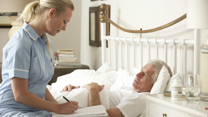 Nurse talking to hospice patient