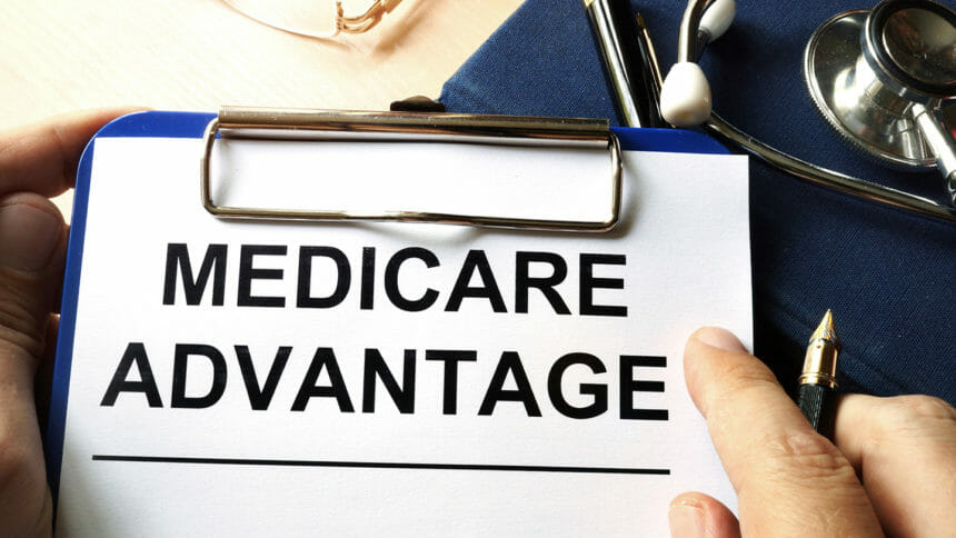 Medicare advantage in a clipboard. Health care insurance concept.