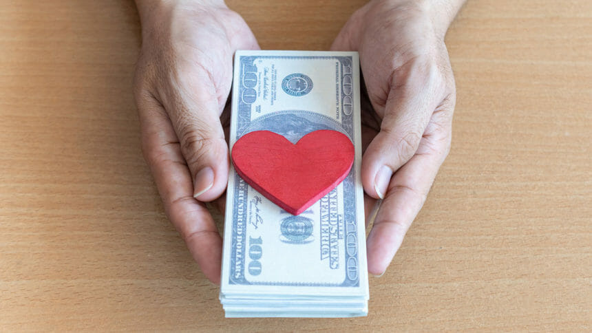 hand holding money with heart