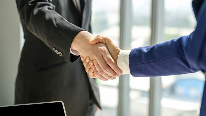 Close-up of Business handshake deal success concept.